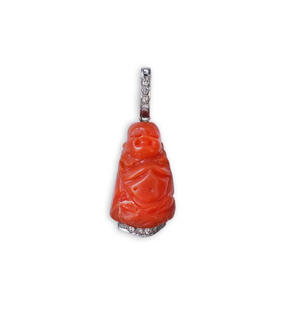 An Art Deco carved coral and diamond pendant, 1920s